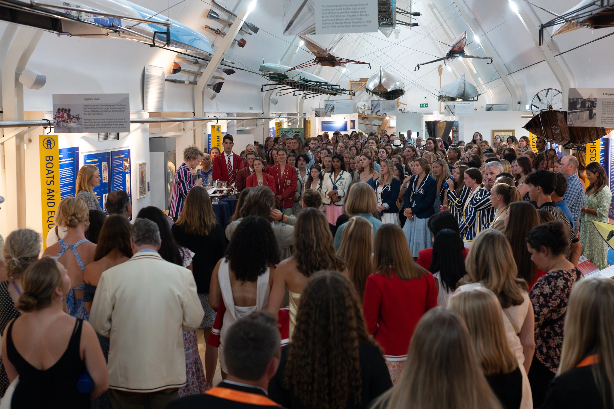 a group of women being addressed by Naomi for the international reception