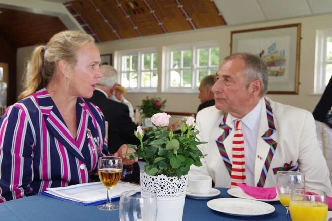 man and women discussing at the lunc table