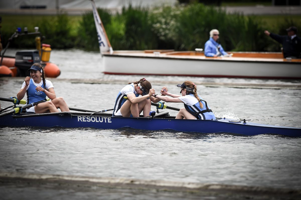 cox and stroke of 8 congratulating each other after winning
