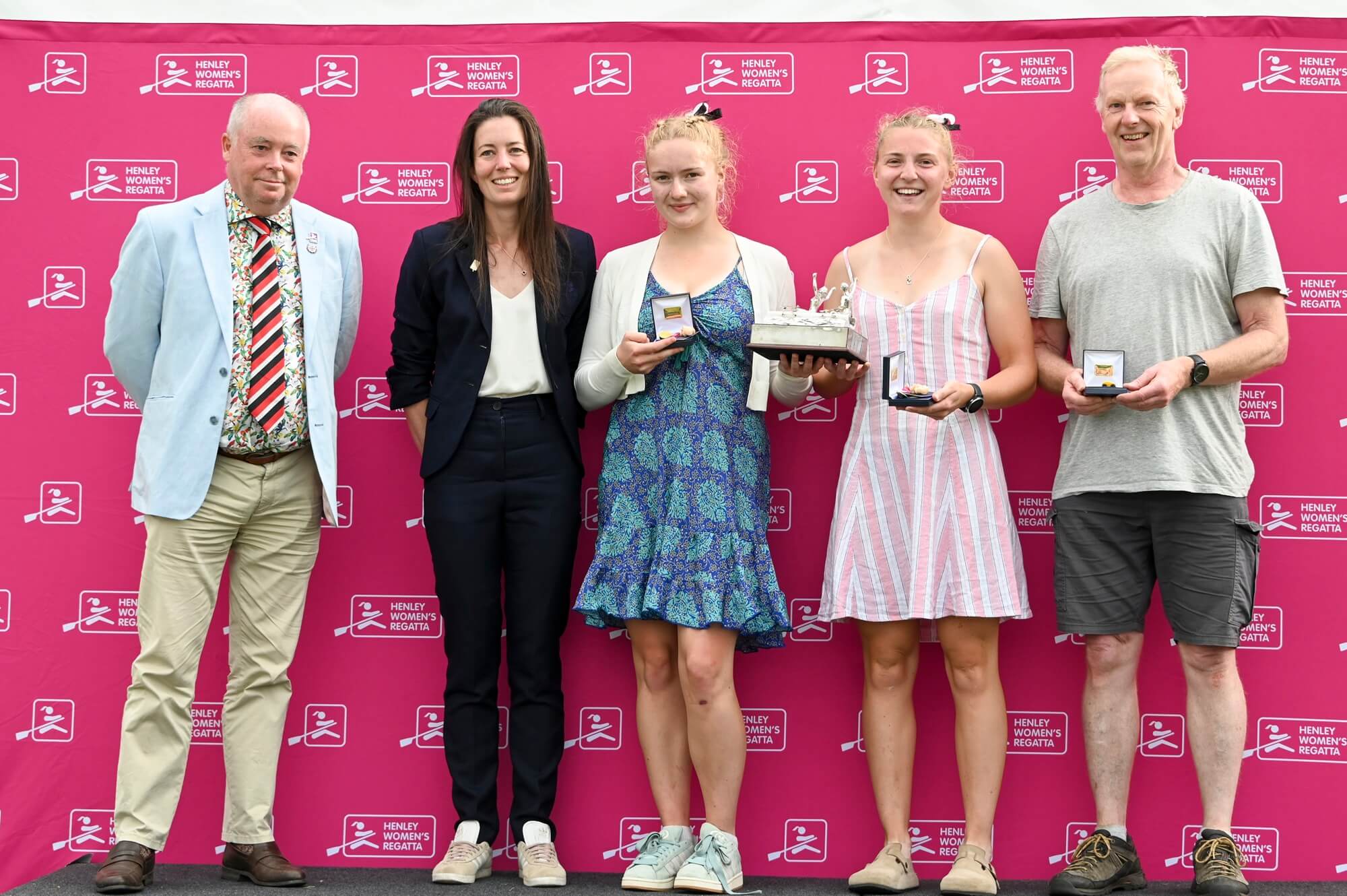 Women with medals and trophy