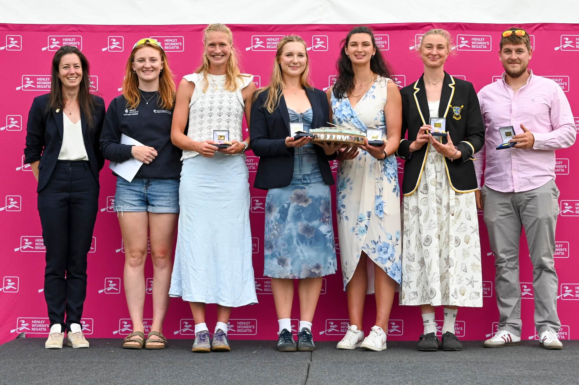 Women with medals and trophy