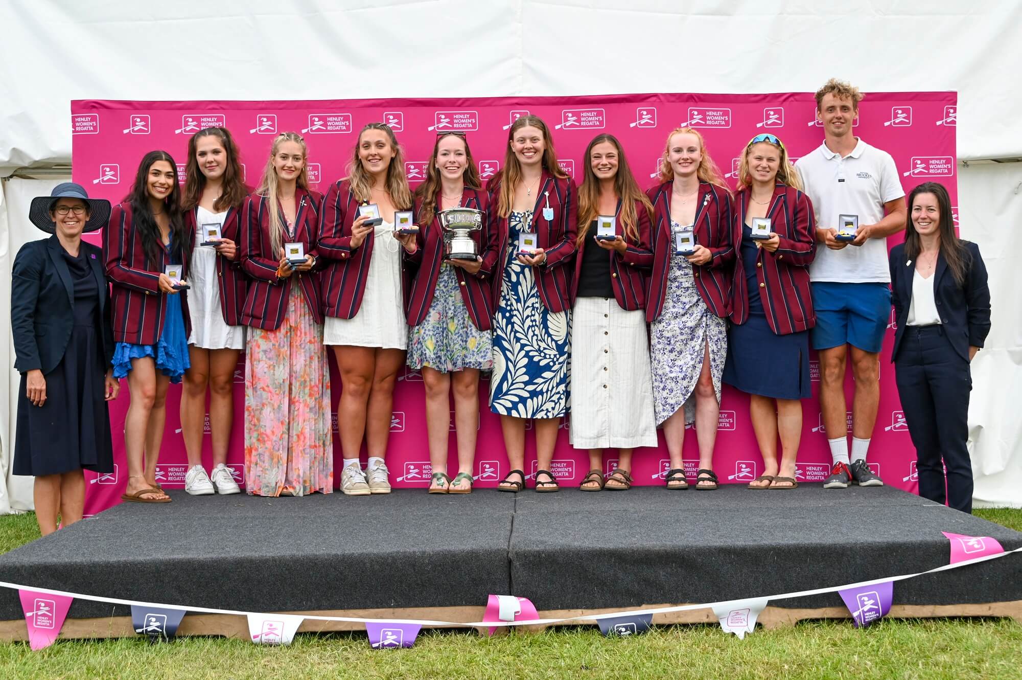 Women with medals and trophy