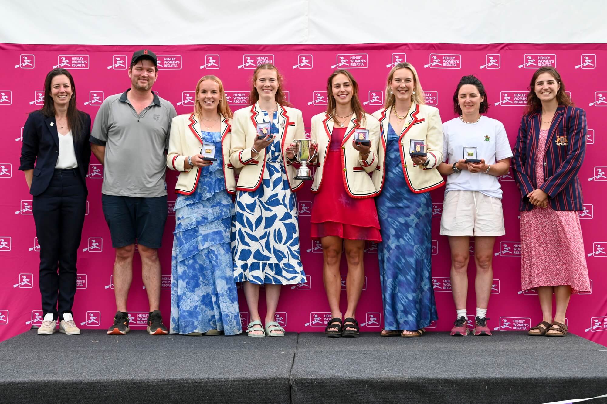 Women with medals and trophy