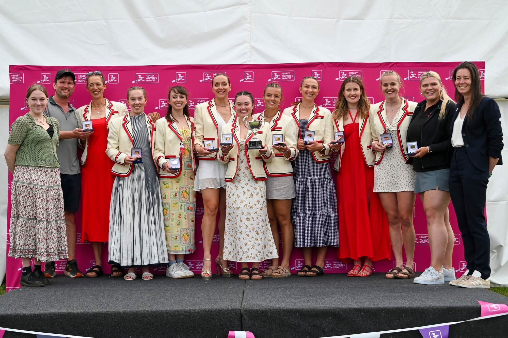 Women with medals and trophy