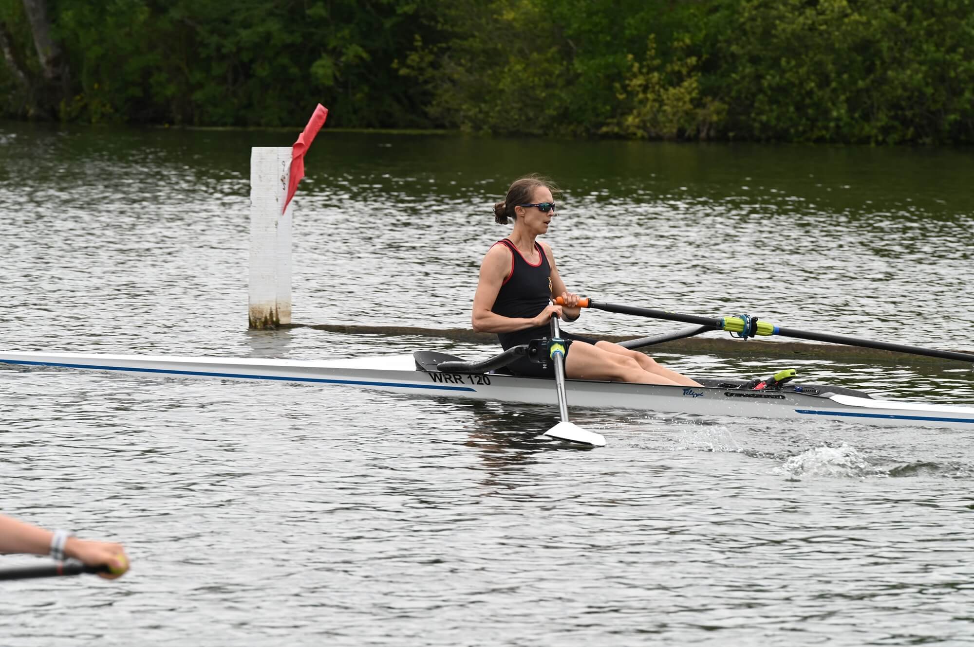 woman racing in single scull