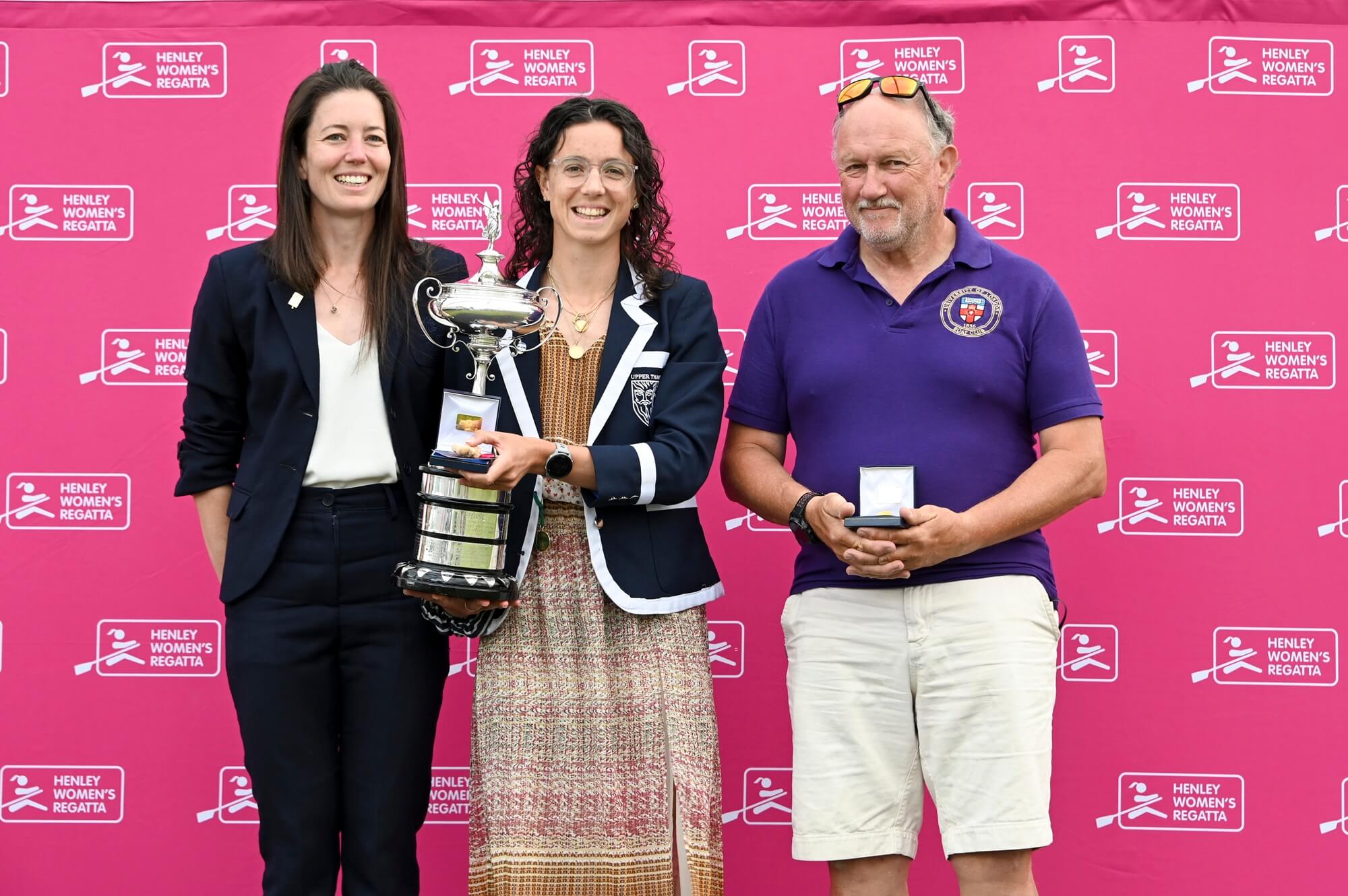 Woman with medal and trophy