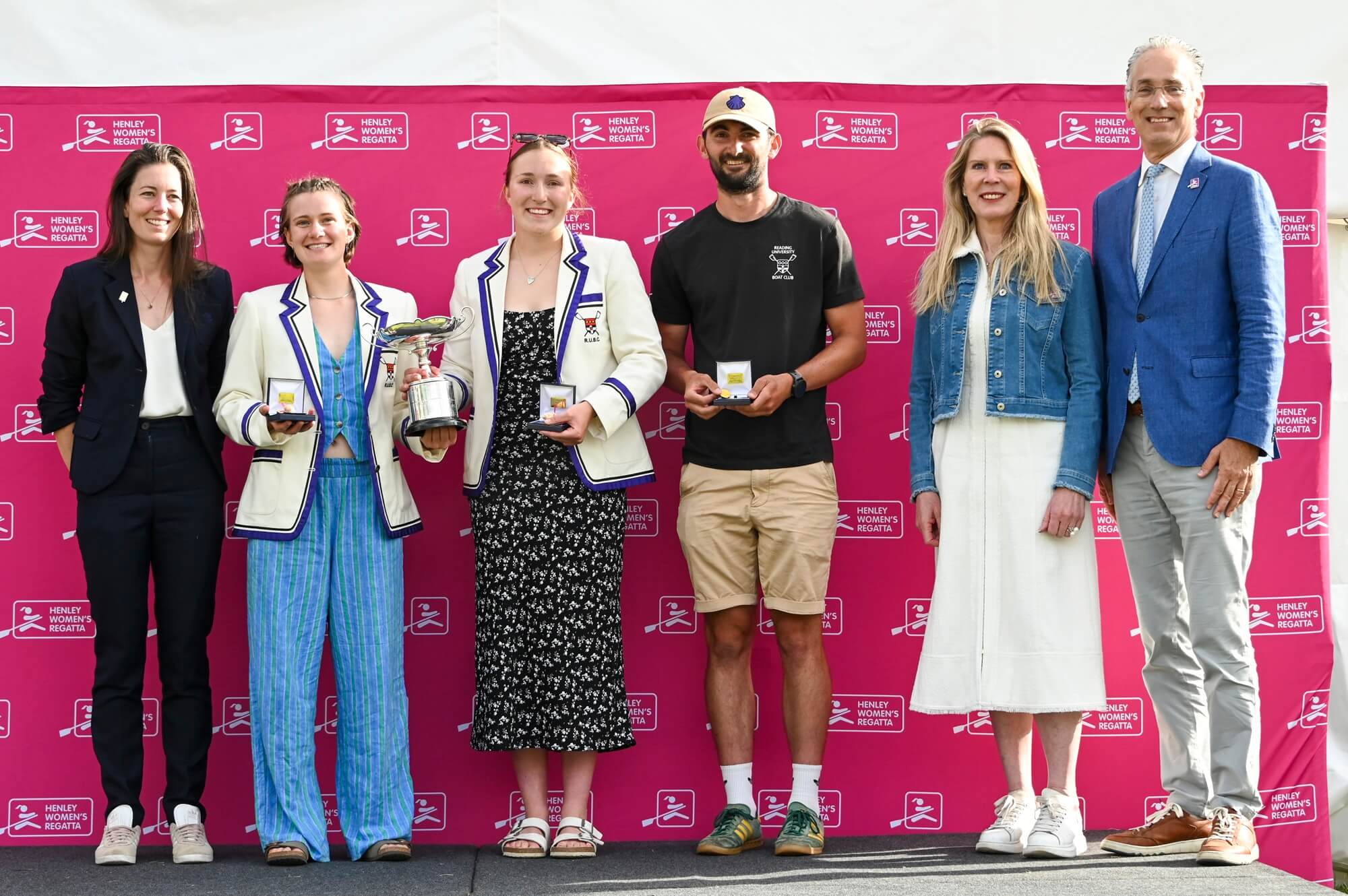 Women with medals and trophy