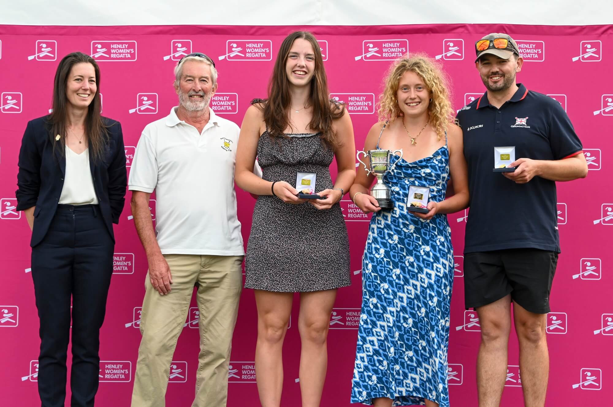 Young women with medals and trophy