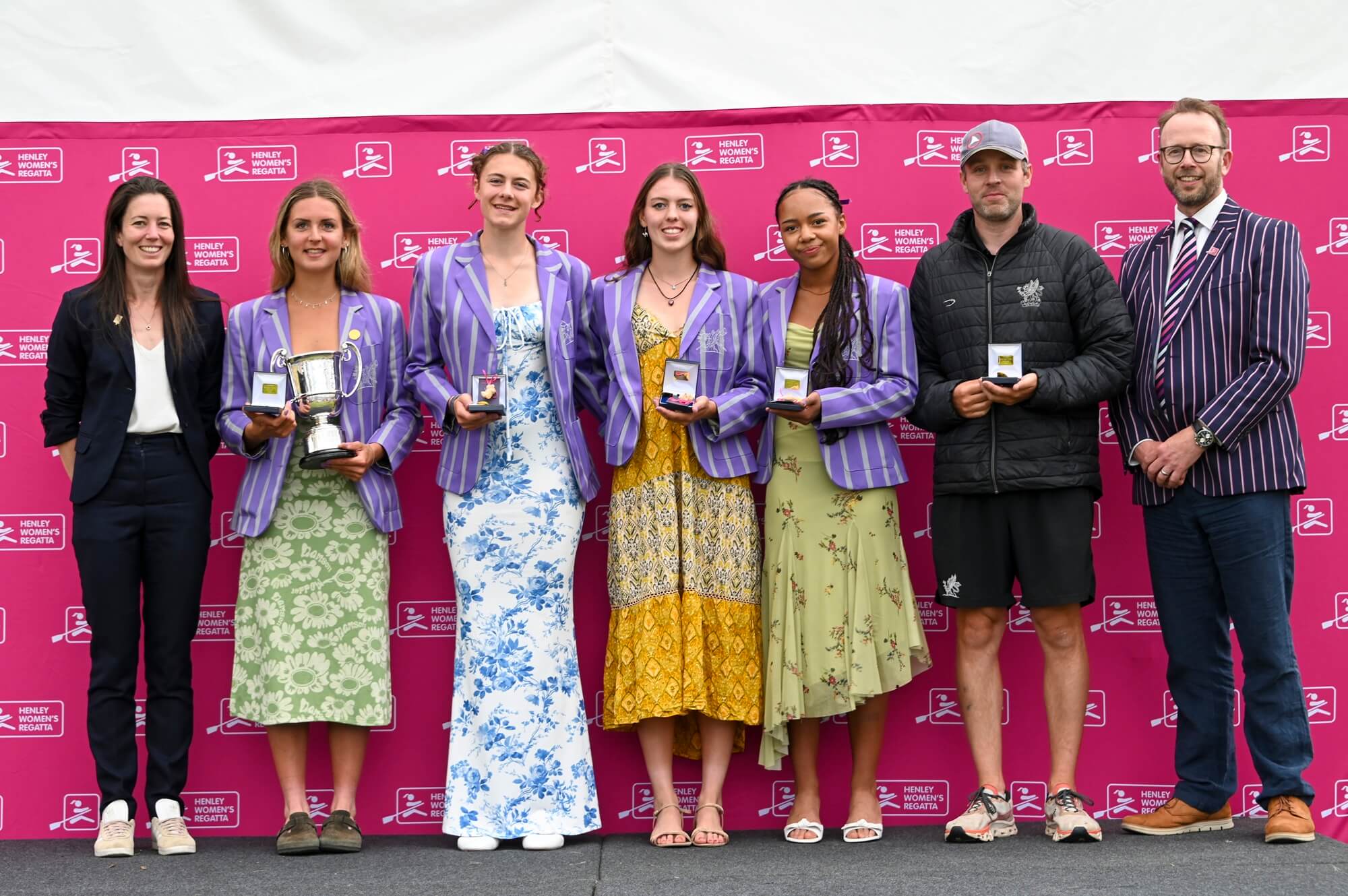 Young women with medals and trophy