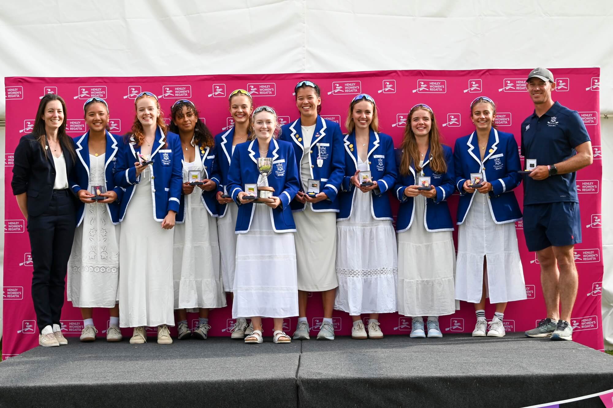 Young women with medals and trophy