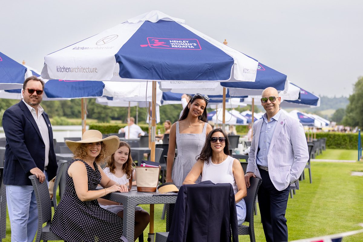 Group of Friends of HWR under an umbrella in the Enclosure