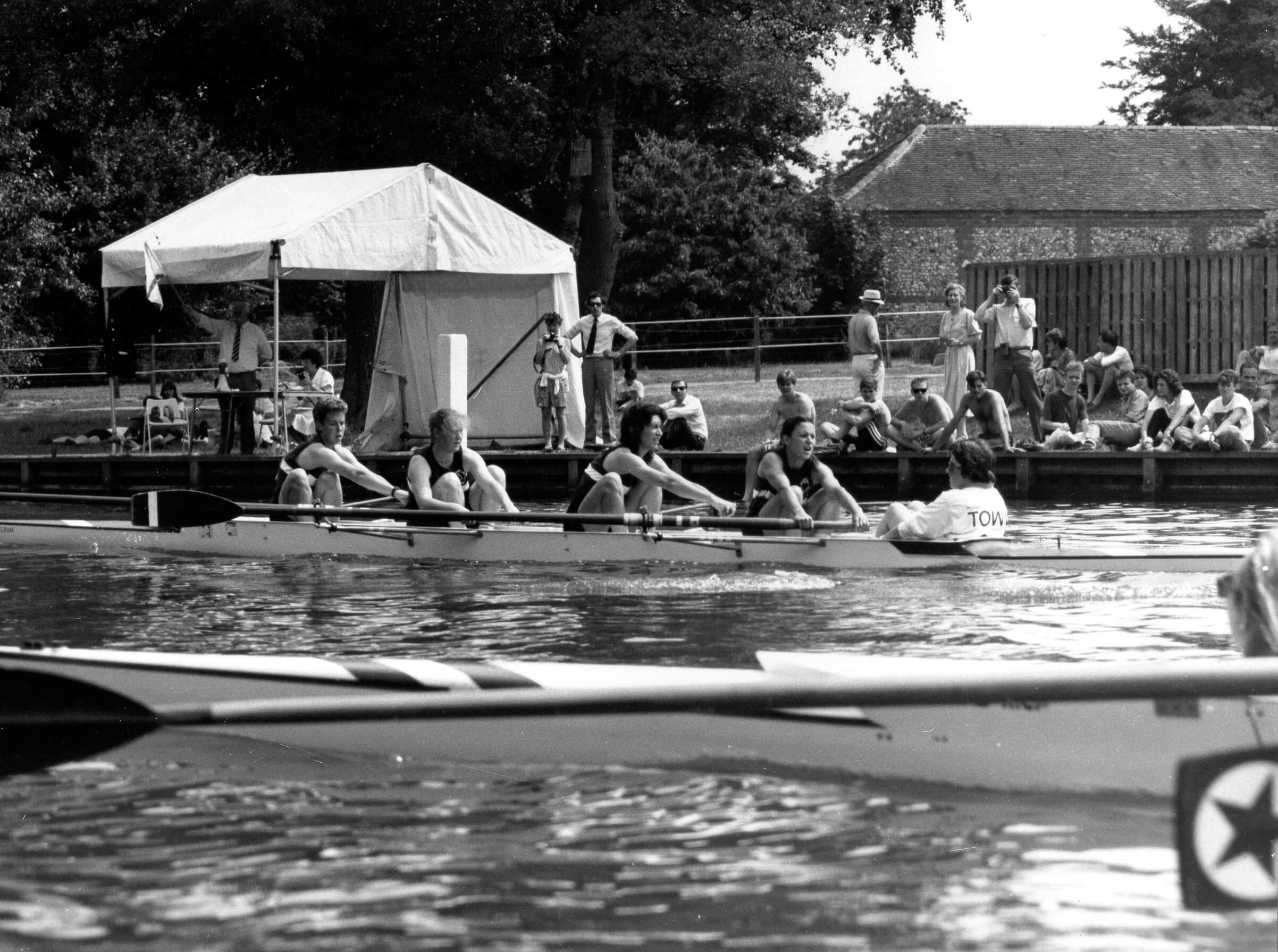 b/w photo of coxed fours racing