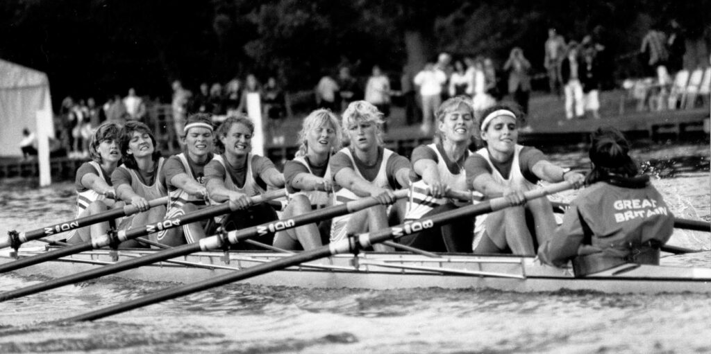 b/w photo of women's eight raicng