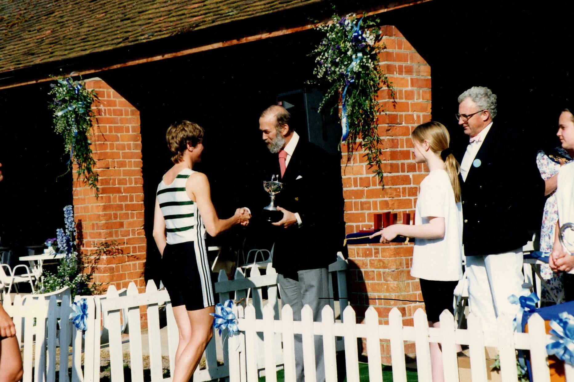 Woman receiving medal from HRH Prince Michael of Kent