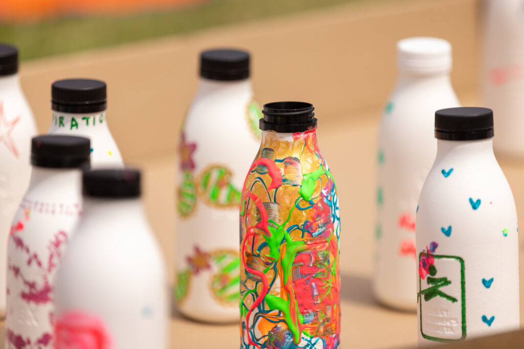 A picture showing several brightly decorated paper bottles
