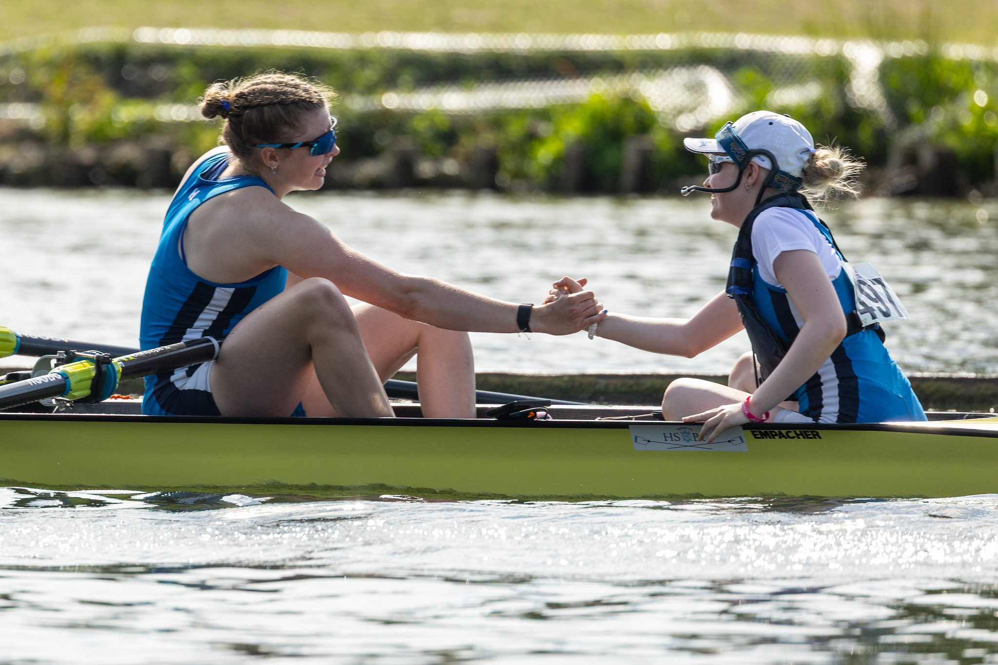 A cox and a rower fist bump after winning at HWR