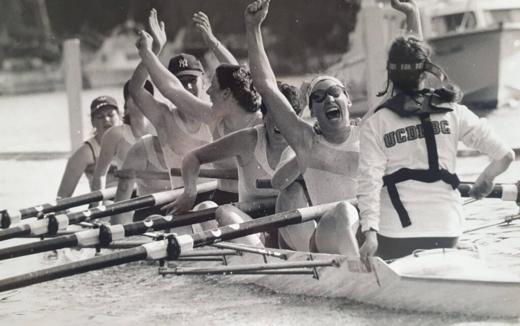 Women's eight with arms in the air celebrating