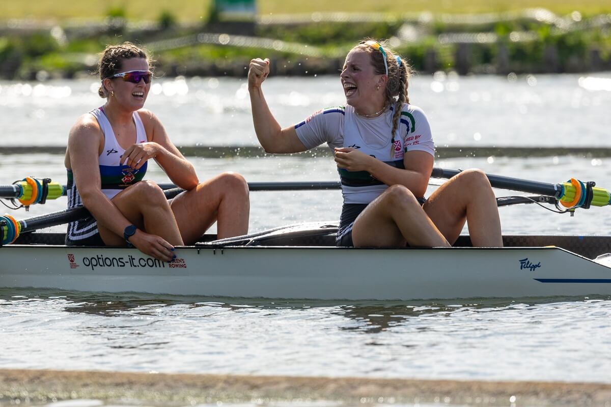 Rower waving arm in celebration